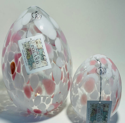 The Zorza Egg Shaped Tea-light, measuring 11.5” features elegant pink murrine inclusions, hand blown in Poland.