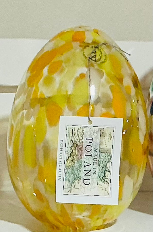 The Zorza Egg Shaped Tea-light, measuring 7.5 features elegant Yellow murrine inclusions, hand blown in Poland.