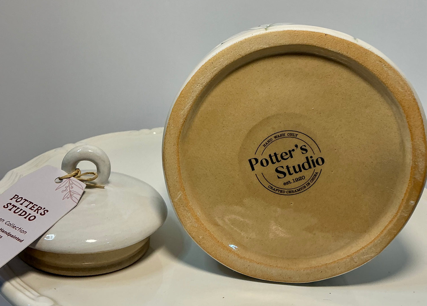 Potter’s Studio artisan collection stoneware storage jar, featuring hand-painted yellow flowers 7”