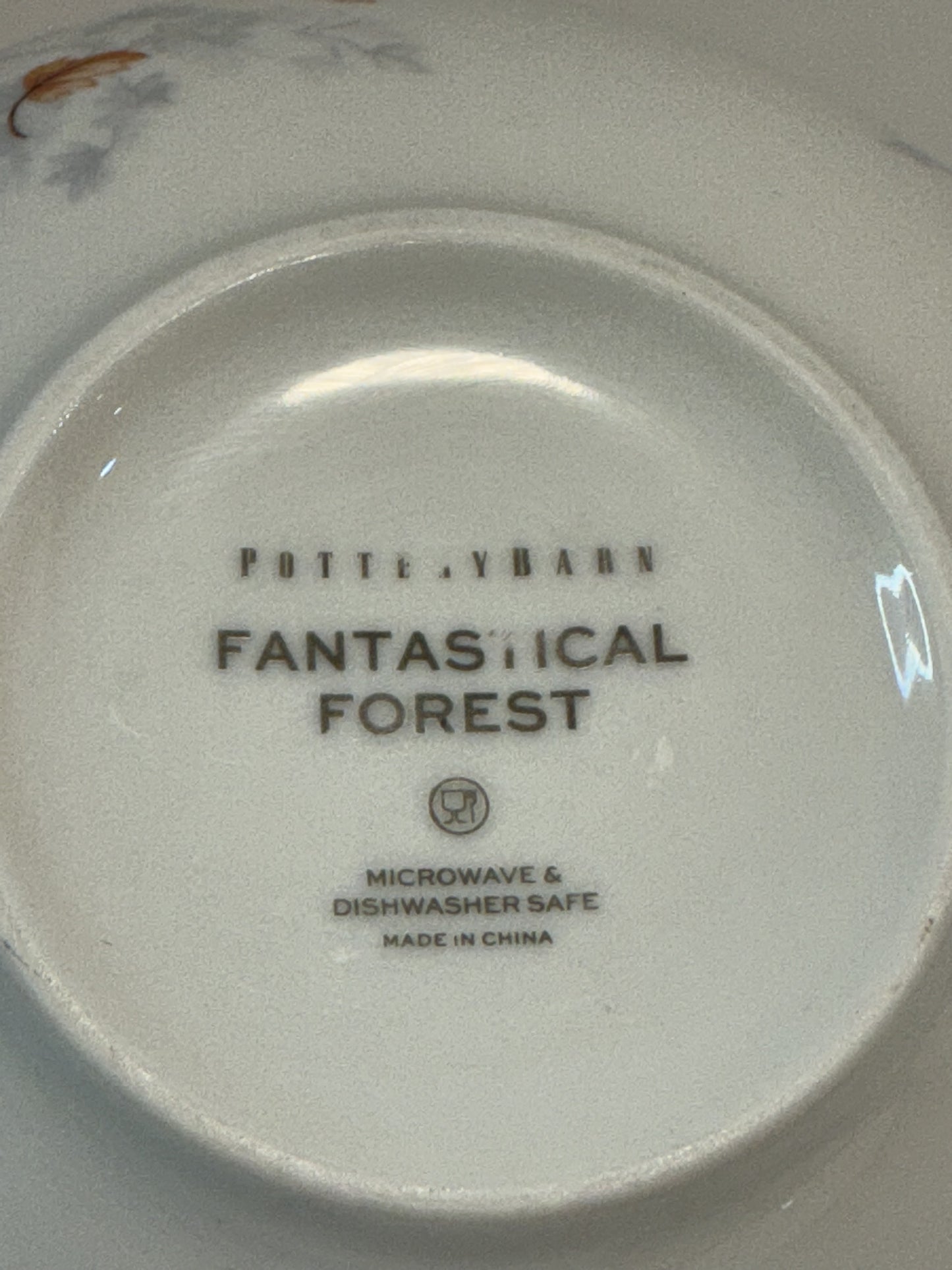 Pottery Barn Fantastical Forest Stoneware Bowl with a hand-painted white glaze decal finish