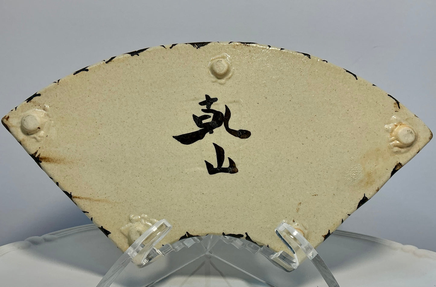 Vintage Japanese Kenzan-Ware Fan-Shaped Dish- Signed Ogata Kenzan Style, hand painted “Kenya”style mark on the base a tribute to the legendary 18th century master ogata kenzan. Traditional Kyoto-ware(kyo-yaki) characterized by its creamy crackle glaze han