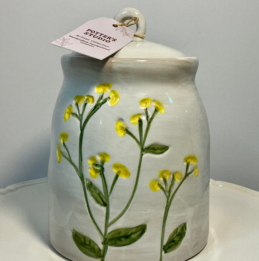 Potter’s Studio artisan collection stoneware storage jar, featuring hand-painted yellow flowers 7”