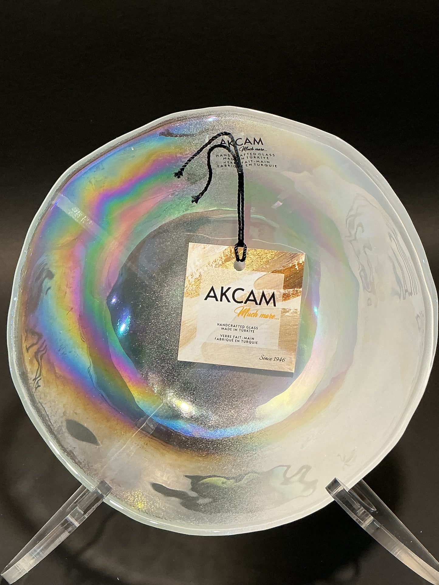 Akcam Iridescent Glass Set of 4 includes a  12” 10” 8” plates and a 6” bowl, which are handmade in Turkey known with their shimmering opal-like finish that changes color with light.