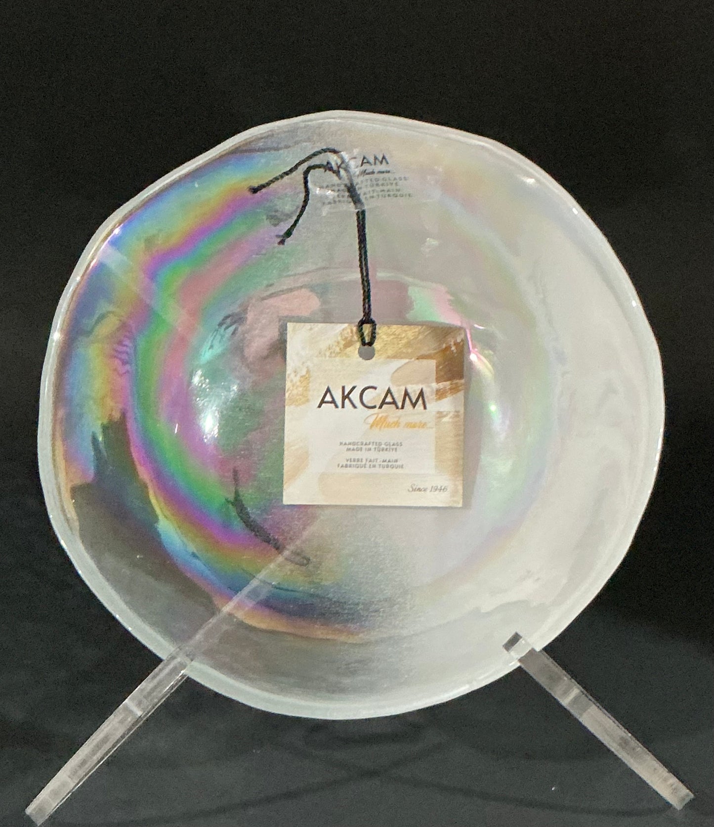 Akcam Iridescent Glass Set of 3 includes a  10” 8” plates and a 6” bowl, which are handmade in Turkey known with their shimmering opal-like finish that changes color with light.