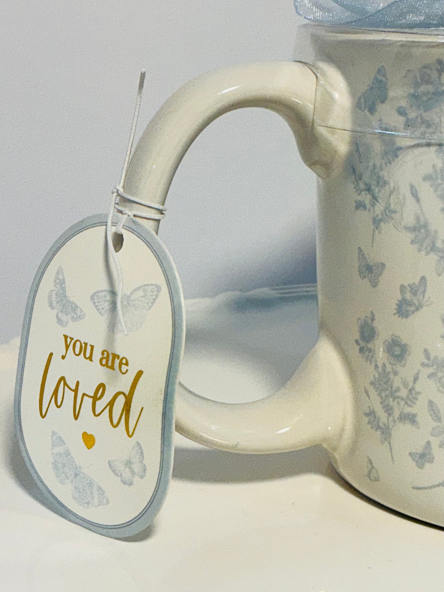 Sunday Morning Ceramics, flowers patterns large mug w/blue ribbon & tag that reads “you are loved”