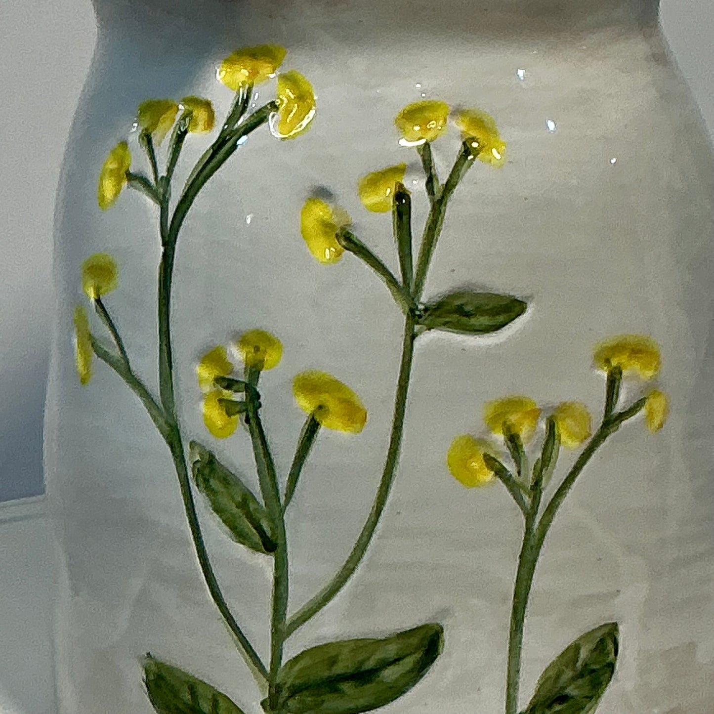 Potter’s Studio artisan collection stoneware storage jar, featuring hand-painted yellow flowers 7”