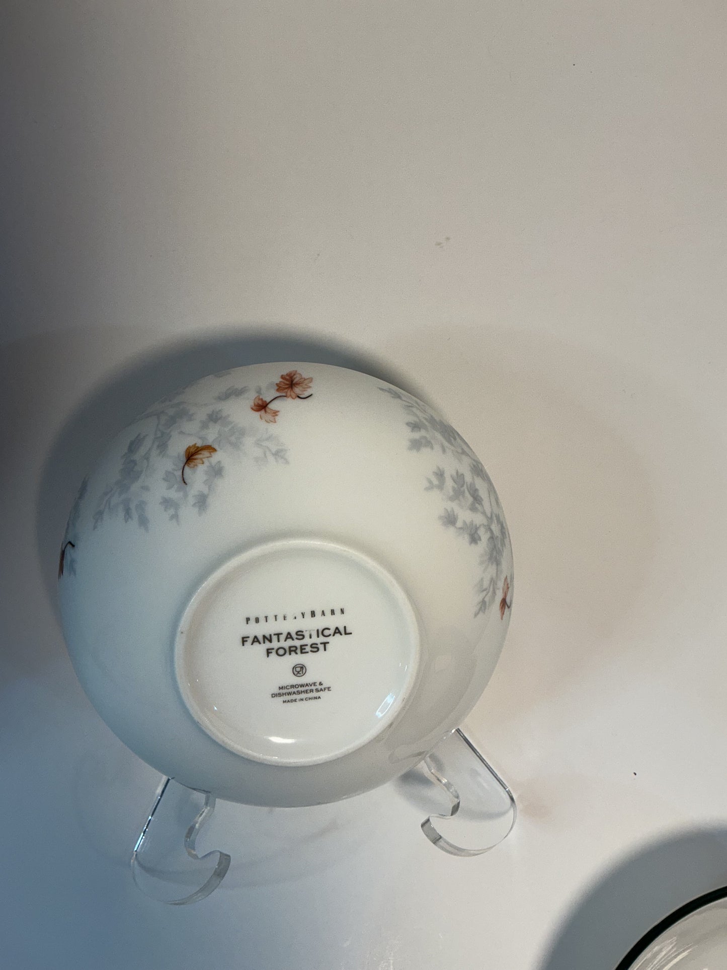 Pottery Barn Fantastical Forest Stoneware Bowl with a hand-painted white glaze decal finish