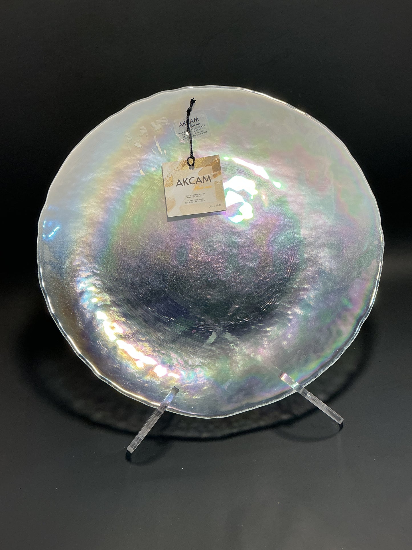 Akcam Iridescent Dinner plate 10” which is handmade in Turkey with their shimmering opal-like finish that changes color with light.